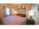 Cozy bedroom with a queen-size bed, nightstands, and decorative curtains on the windows at 3333 26Th E Ave # 1107, Bradenton, FL 34208