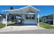 Charming single-story home with covered parking and well-maintained landscaping under a clear blue sky at 3333 26Th E Ave # 1107, Bradenton, FL 34208