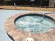 Bubbling hot tub with brick surround at community center at 3333 26Th E Ave # 1107, Bradenton, FL 34208