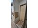 Laundry area with a stacked washer and dryer unit and a door leading to another room at 3333 26Th E Ave # 1107, Bradenton, FL 34208
