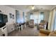 Living area with a sofa, dining table, and large windows at 3333 26Th E Ave # 1107, Bradenton, FL 34208