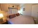 Main bedroom with ceiling fan, decorative valances, and bedside tables at 3333 26Th E Ave # 1107, Bradenton, FL 34208