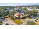 Stunning aerial view of a home nestled by a serene lake with lush greenery and neighboring properties at 3468 51St Avenue W Dr, Bradenton, FL 34210