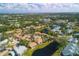 A high aerial shot of the community showing lush greenery, trees, ponds, and home rooftops at 3468 51St Avenue W Dr, Bradenton, FL 34210