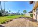 View of a paved patio overlooking a pond with palm trees and lush landscaping at 3468 51St Avenue W Dr, Bradenton, FL 34210