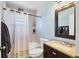 Bathroom features a shower-tub combo, and a granite vanity for a luxurious feel at 3468 51St Avenue W Dr, Bradenton, FL 34210