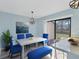 Cozy dining room with a sleek table and chairs complemented by stylish light fixture and a view to the outdoors at 3468 51St Avenue W Dr, Bradenton, FL 34210