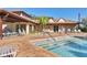 Community pool and clubhouse with plenty of seating for residents at 3468 51St Avenue W Dr, Bradenton, FL 34210