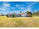 Large backyard with a screened pool and shed at 3988 Abbotsford St, North Port, FL 34287