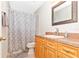 Clean and bright bathroom with single vanity, toilet, and shower/tub combo at 3988 Abbotsford St, North Port, FL 34287