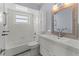 Updated bathroom with bathtub, toilet and modern vanity at 4001 17Th W Ave, Bradenton, FL 34205