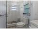 Remodeled bathroom features a glass shower, linen closet and wood look floors at 4001 17Th W Ave, Bradenton, FL 34205