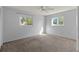 Cozy bedroom with carpeted floors and natural light from two large windows at 4001 17Th W Ave, Bradenton, FL 34205