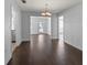 Bright dining room with hardwood floors, chandelier, and easy kitchen access at 4001 17Th W Ave, Bradenton, FL 34205