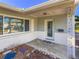 Inviting front porch with white brick accents and decorative support columns welcomes you home at 4001 17Th W Ave, Bradenton, FL 34205