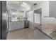 Modern kitchen with white cabinets, granite countertops, and stainless steel appliances at 4001 17Th W Ave, Bradenton, FL 34205