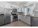 Well-appointed kitchen with stainless steel appliances, granite countertops, and white cabinets at 4001 17Th W Ave, Bradenton, FL 34205