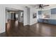 Open-concept living area boasts hardwood floors, blue cabinetry, and natural light at 4001 17Th W Ave, Bradenton, FL 34205