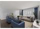 Spacious living room with modern furniture, hardwood floors, and large windows at 4001 17Th W Ave, Bradenton, FL 34205