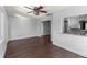 Bright living room with beautiful hardwood floors and a ceiling fan at 4001 17Th W Ave, Bradenton, FL 34205