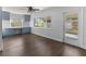 Bright, open floorplan with beautiful hardwood floors, a ceiling fan and large windows at 4001 17Th W Ave, Bradenton, FL 34205