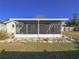 A screened-in patio provides an outdoor area for enjoying the outdoors in a bug-free setting at 4001 17Th W Ave, Bradenton, FL 34205