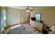 Bedroom with ample closet space, ceiling fan, and wood floors at 4339 Bowling Green Cir # 19, Sarasota, FL 34233