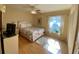 Bedroom with wood floors, ceiling fan, and a cozy atmosphere at 4339 Bowling Green Cir # 19, Sarasota, FL 34233