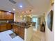 Kitchen with wood cabinets, granite countertops, stainless steel appliances, and breakfast bar at 4339 Bowling Green Cir # 19, Sarasota, FL 34233