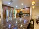 Kitchen with granite counters, wood cabinets, stainless steel appliances, and a breakfast bar at 4339 Bowling Green Cir # 19, Sarasota, FL 34233