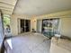 Screened porch with tile flooring and access to the backyard at 4339 Bowling Green Cir # 19, Sarasota, FL 34233