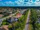 Aerial view of neighborhood with houses and a path at 4432 Golden Lake Dr, Sarasota, FL 34233