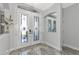 Elegant entryway with double doors and marble flooring at 4432 Golden Lake Dr, Sarasota, FL 34233