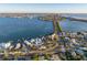 Aerial view of a home with a bridge and city skyline in the background at 451 Bowdoin Cir, Sarasota, FL 34236