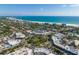 Aerial perspective of a lively coastal town with lush greenery, and buildings at 451 Bowdoin Cir, Sarasota, FL 34236