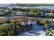 High-angle view showcasing a coastal property with lush greenery and a welcoming path at 451 Bowdoin Cir, Sarasota, FL 34236