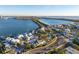 Stunning aerial view of a waterfront home nestled in a vibrant coastal community at 451 Bowdoin Cir, Sarasota, FL 34236