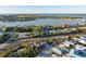 Aerial view focusing on the house and surrounding area, including a road and neighboring properties at 451 Bowdoin Cir, Sarasota, FL 34236