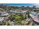 Aerial view of a vibrant town center with a central park and surrounding businesses at 451 Bowdoin Cir, Sarasota, FL 34236