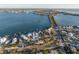 Coastal neighborhood shown with a single home highlighted and a long bridge over the water in the background at 451 Bowdoin Cir, Sarasota, FL 34236