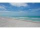 Scenic beach with white sand and clear teal water under blue sky at 451 Bowdoin Cir, Sarasota, FL 34236