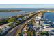 Elevated overview of the home and neighborhood, showcasing its location near a bridge and the waterway at 451 Bowdoin Cir, Sarasota, FL 34236