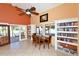 Clubhouse library with reading table and chairs, bookshelves, and French doors at 4515 45Th W Ave # 202A, Bradenton, FL 34210