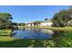 Scenic community pond with a fountain and lush landscaping at 4515 45Th W Ave # 202A, Bradenton, FL 34210