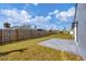 Fenced backyard with patio area and green lawn at 455 Mexicali Ave, Venice, FL 34293