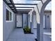 Covered entryway with arches, white front door, and decorative wind chimes at 455 Mexicali Ave, Venice, FL 34293