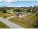 Aerial view of a house with a pool and surrounding yard at 5105 Bannock Cir, North Port, FL 34288