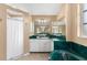Well-appointed bathroom with green marble vanity, corner bathtub, and shower at 5105 Bannock Cir, North Port, FL 34288