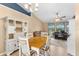 Dining room with white decorative hutch, chandelier, and wooden table at 5105 Bannock Cir, North Port, FL 34288