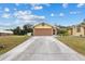Front view of a single-story home with a two-car garage at 5105 Bannock Cir, North Port, FL 34288